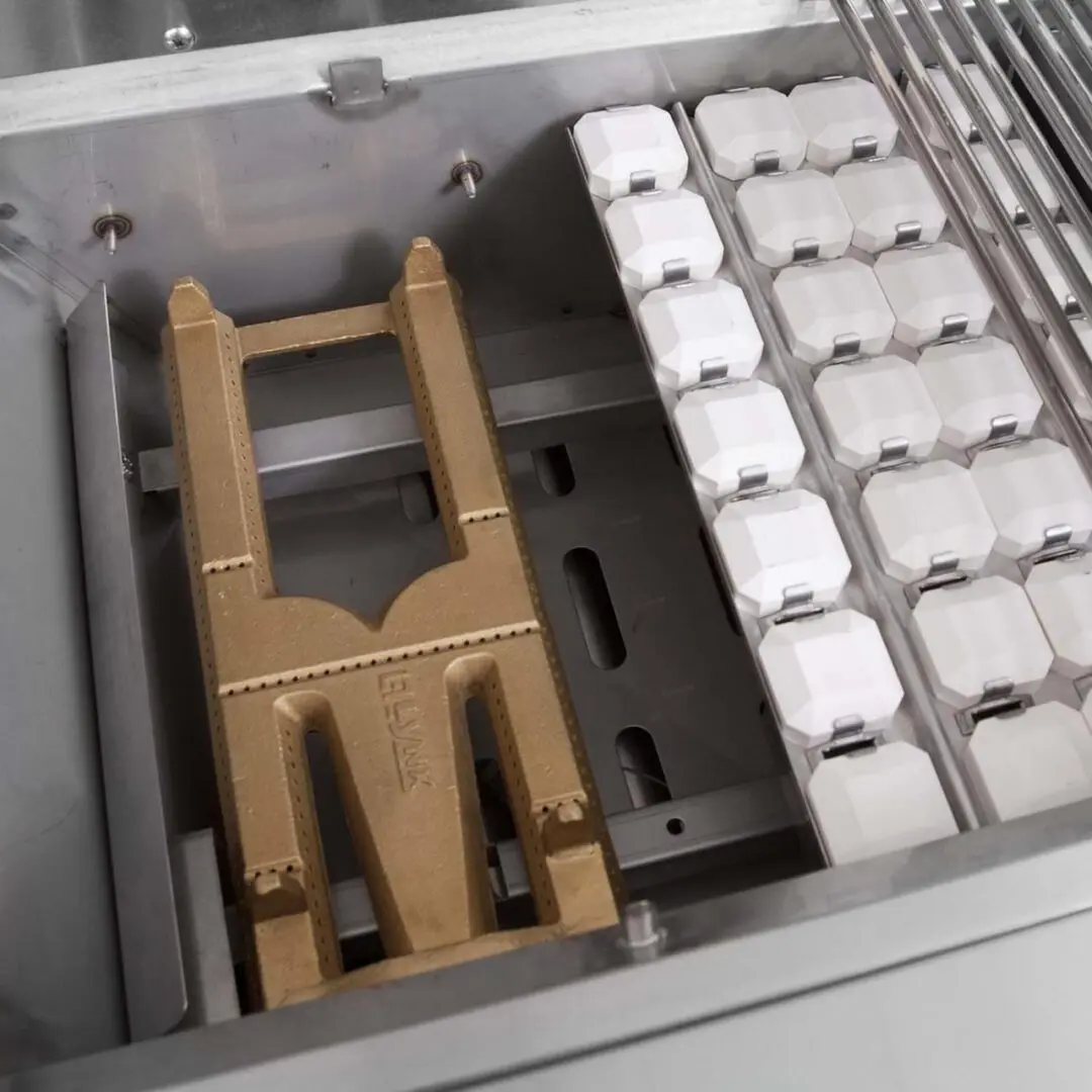 Vintage computer keyboard with a plastic tool on top.