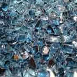 Close-up of shattered blue glass pieces scattered together.