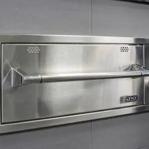 Stainless steel commercial kitchen pass-through window with shelf.