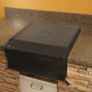 Black rubber sheet draped over kitchen counter edge.