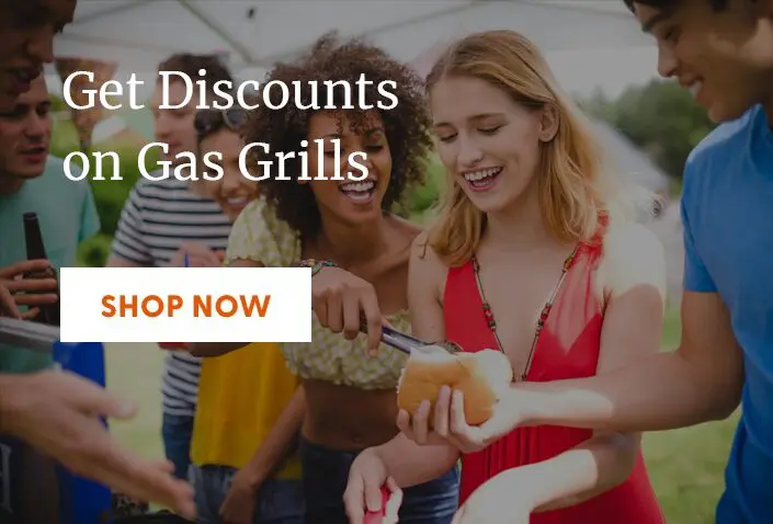 Family enjoying a barbecue with gas grills and hot dogs.