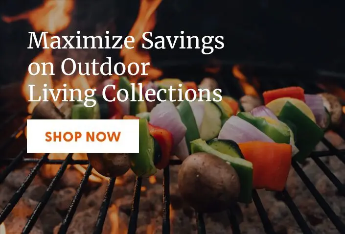 Grilled vegetable skewers cooking on a barbecue grill.