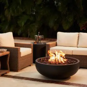 Outdoor patio with fire pit and seating.